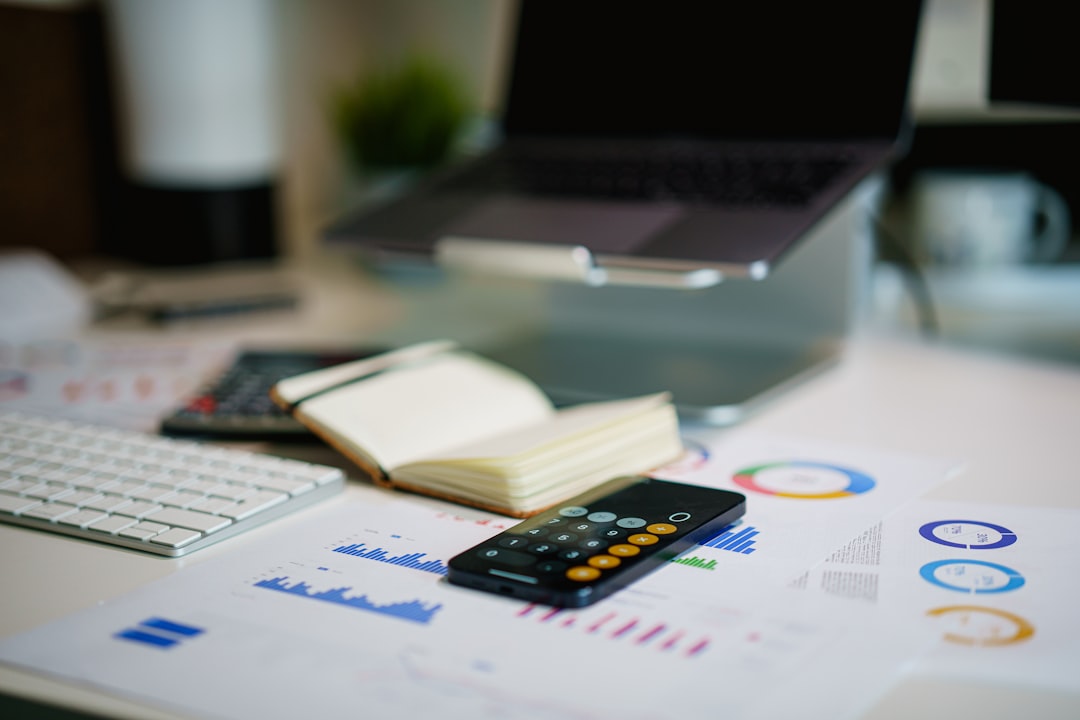 Financial reports and calculator representing bookkeeping and accounting outsourcing support