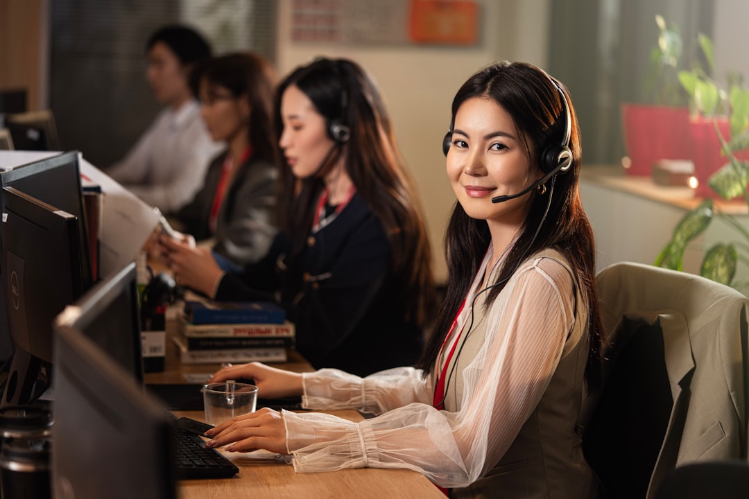 Customer support agent in an office representing call center and dialer services