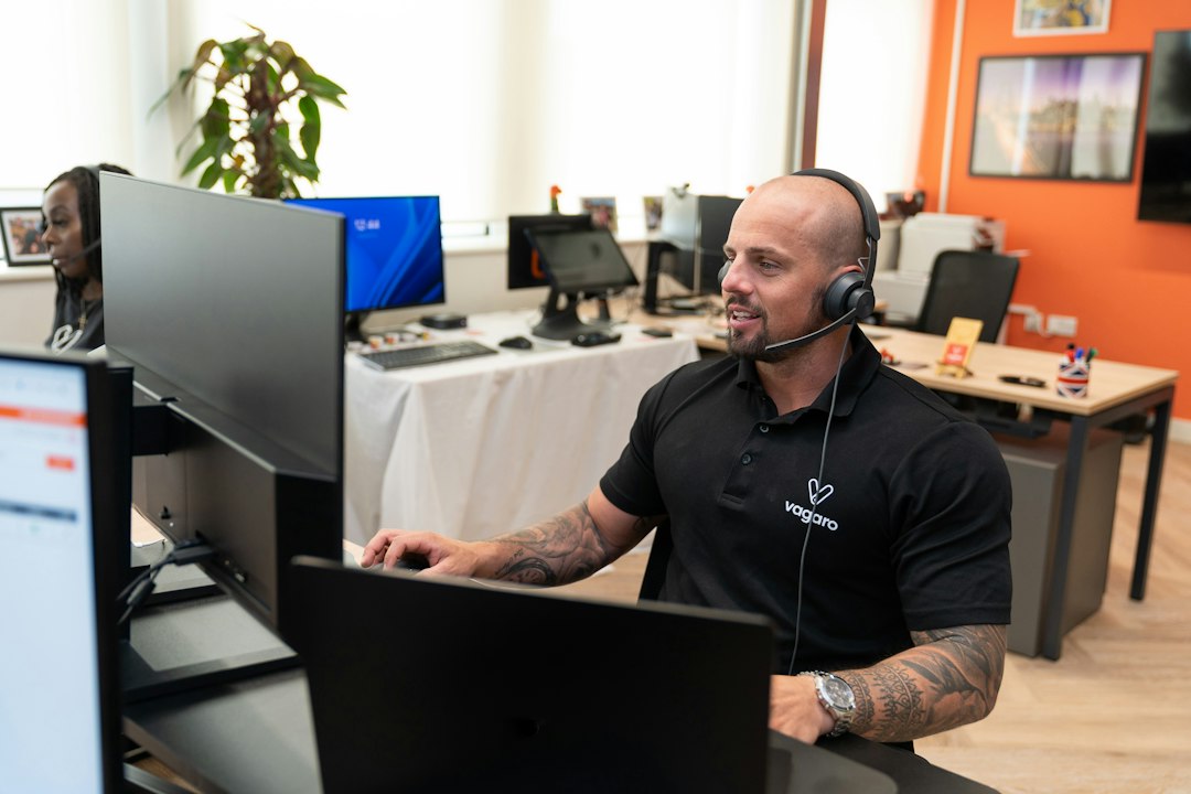 Customer support specialist using a headset in a professional contact center