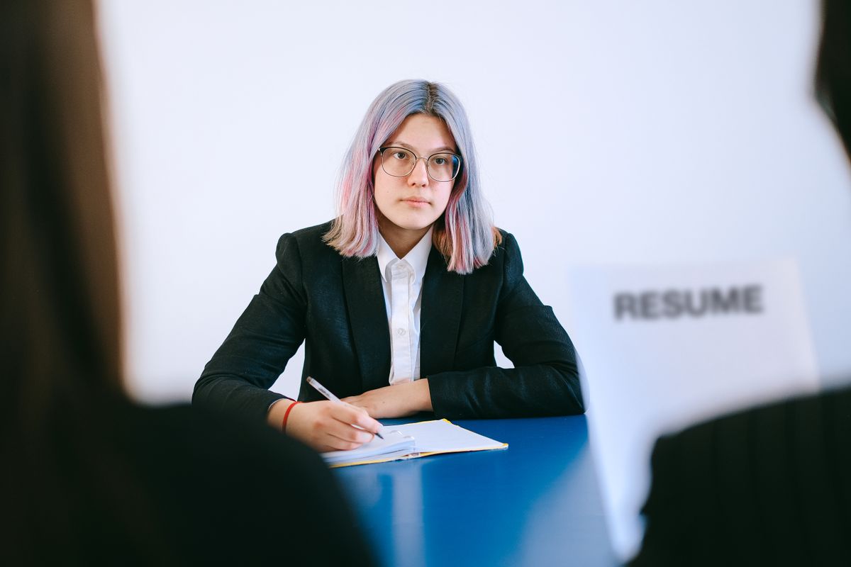 Team member taking notes during a process review meeting