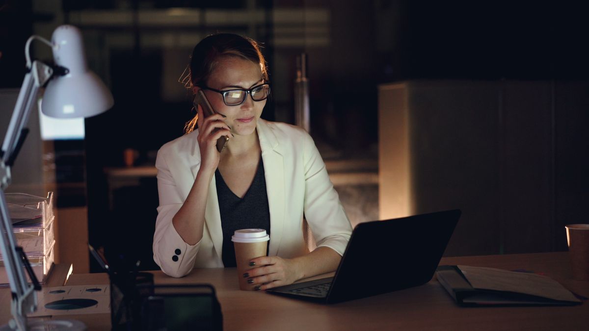 Professional working late on a laptop in a quiet office
